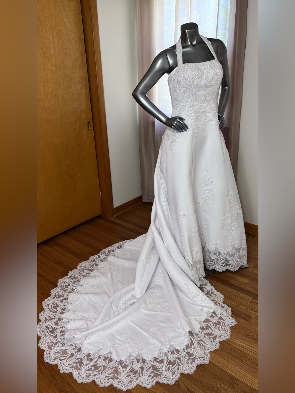 Michaelangelo style V8377 white satin halter wedding gown .